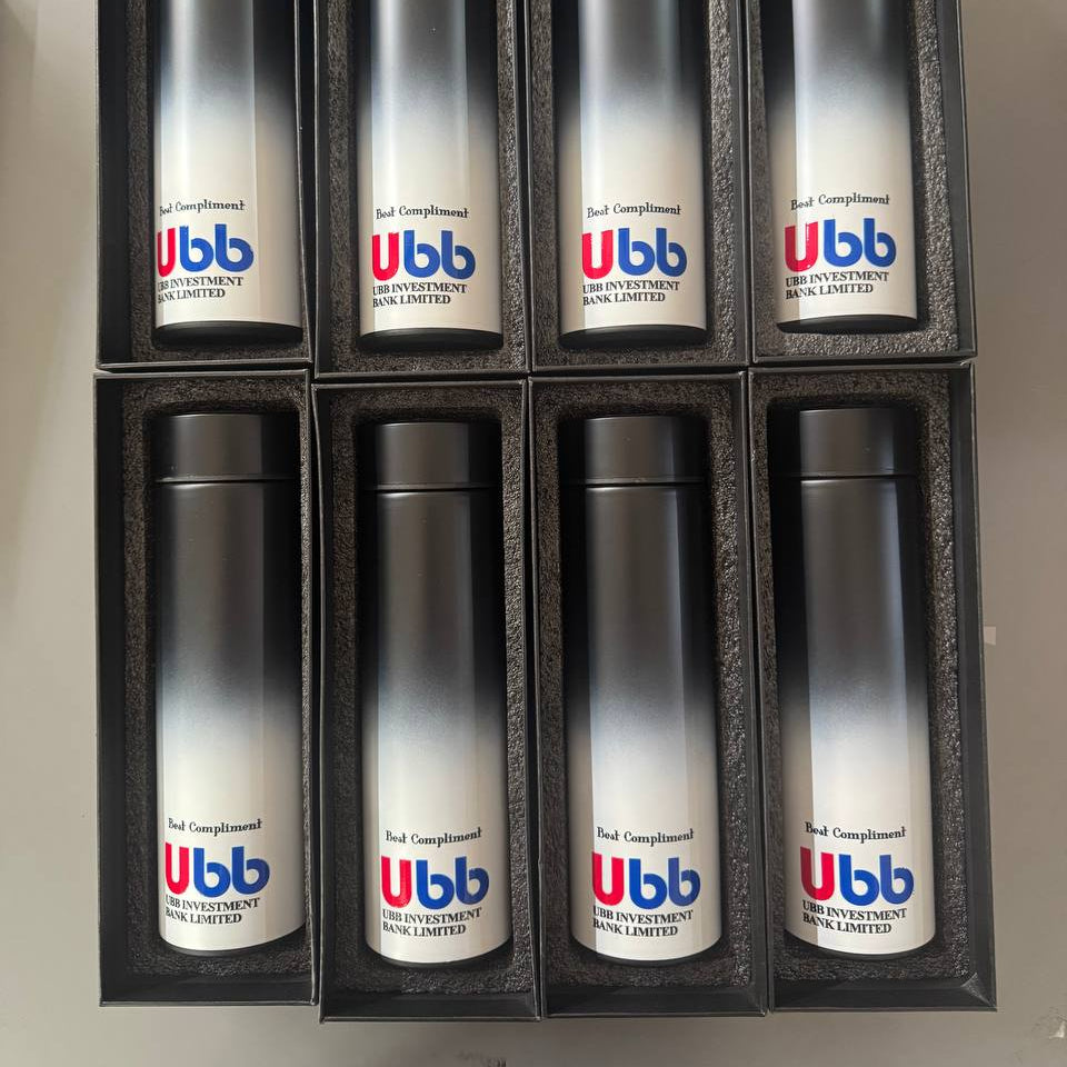 Set of eight UBB branded metal tumblers in a box