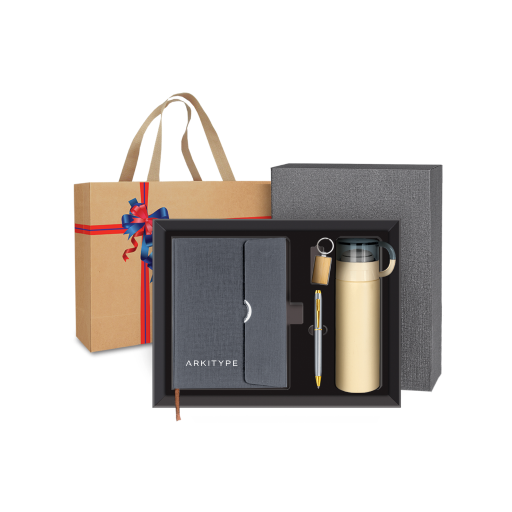 Corporate Gift set with a notebook, pen, and thermos in a box, with a decorative bag in the background.