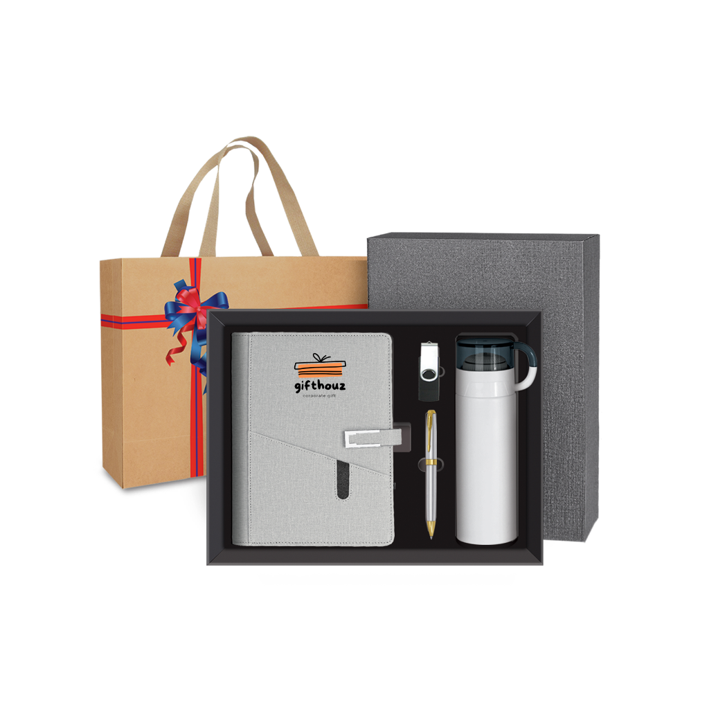 Gift set with notebook, pen, and thermos in a box, with a gift bag in the background.