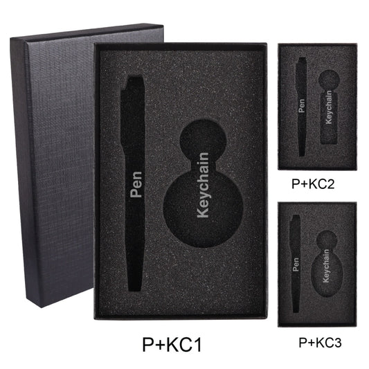 B 80 Gift Box Packaging Black foam packaging insert for a pen and keychain with cutouts for each item.
