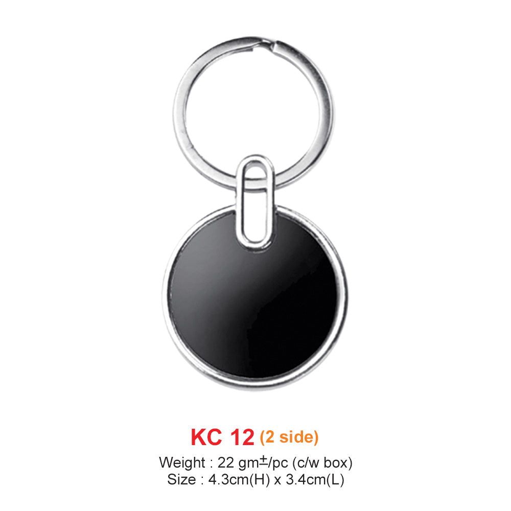 Black round keychain with silver ring on a white background